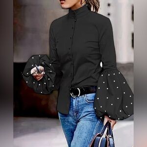 Elegant Black Blouse with Statement Sleeves